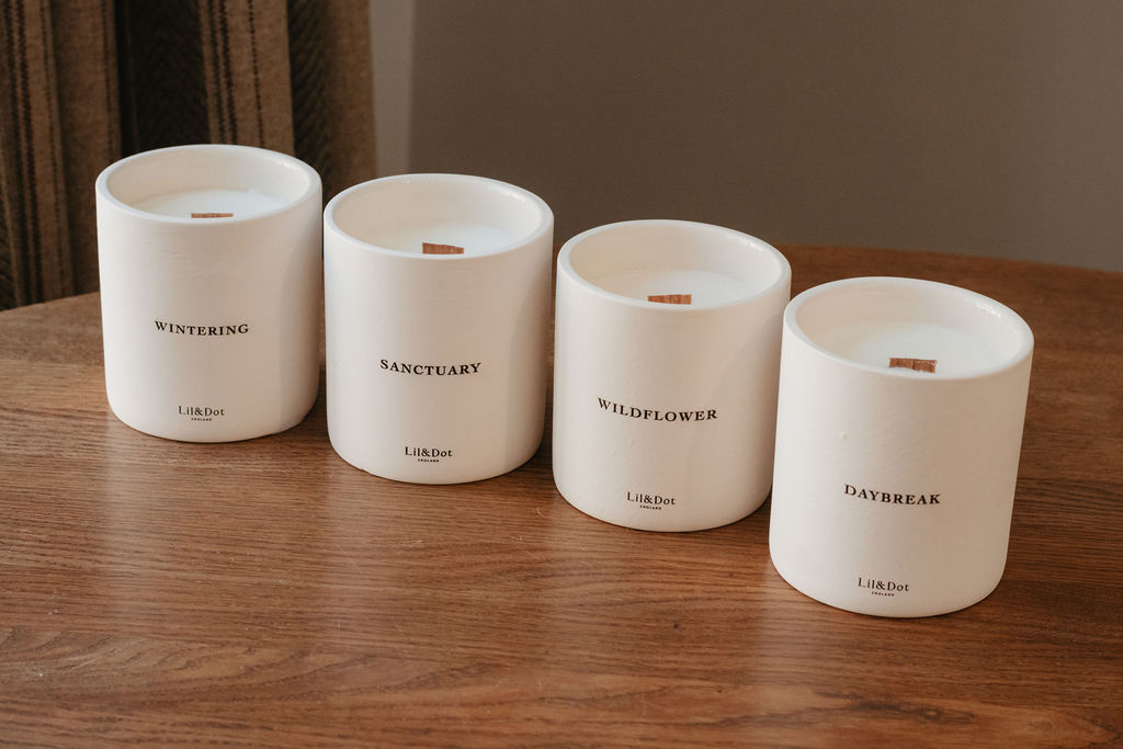 All four Lil & Dot candles on a wooden table